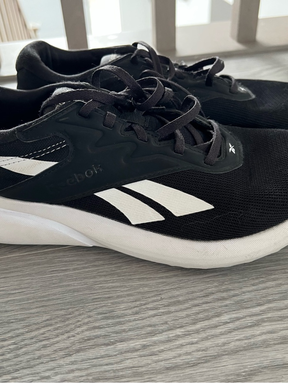 Reebok women’s size 9 Black and White Running Sneakers